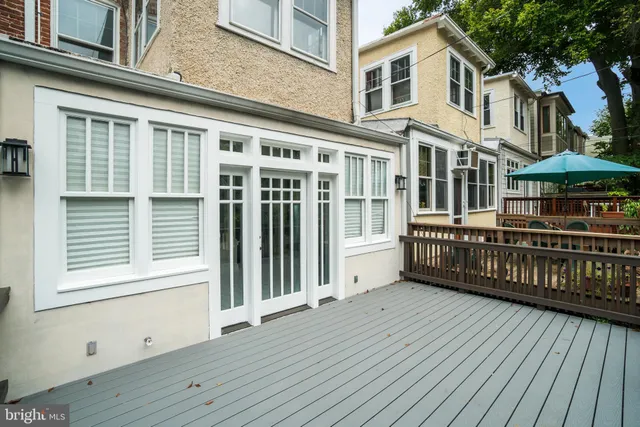 a view of a house with wooden deck