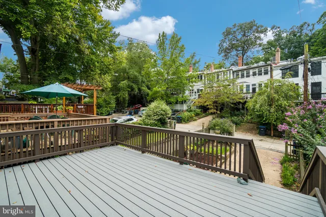 a view of balcony with deck and wooden floor