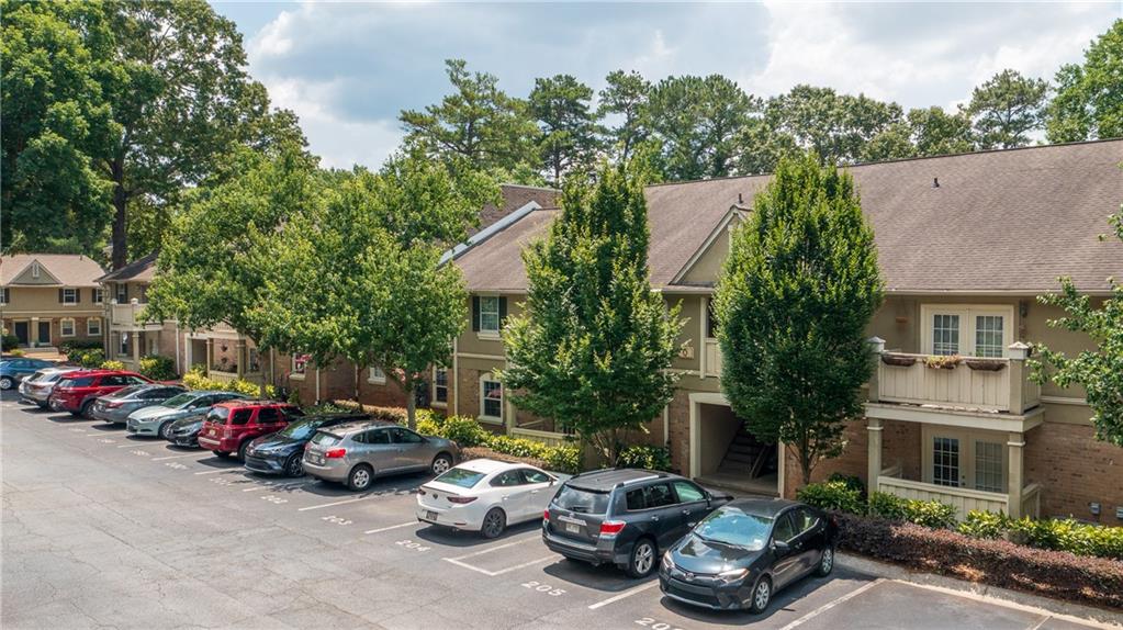 6900 Roswell Road, Unit Q15 Atlanta, GA 30328 - Photo 1 of 1 a car parked in front of a house
