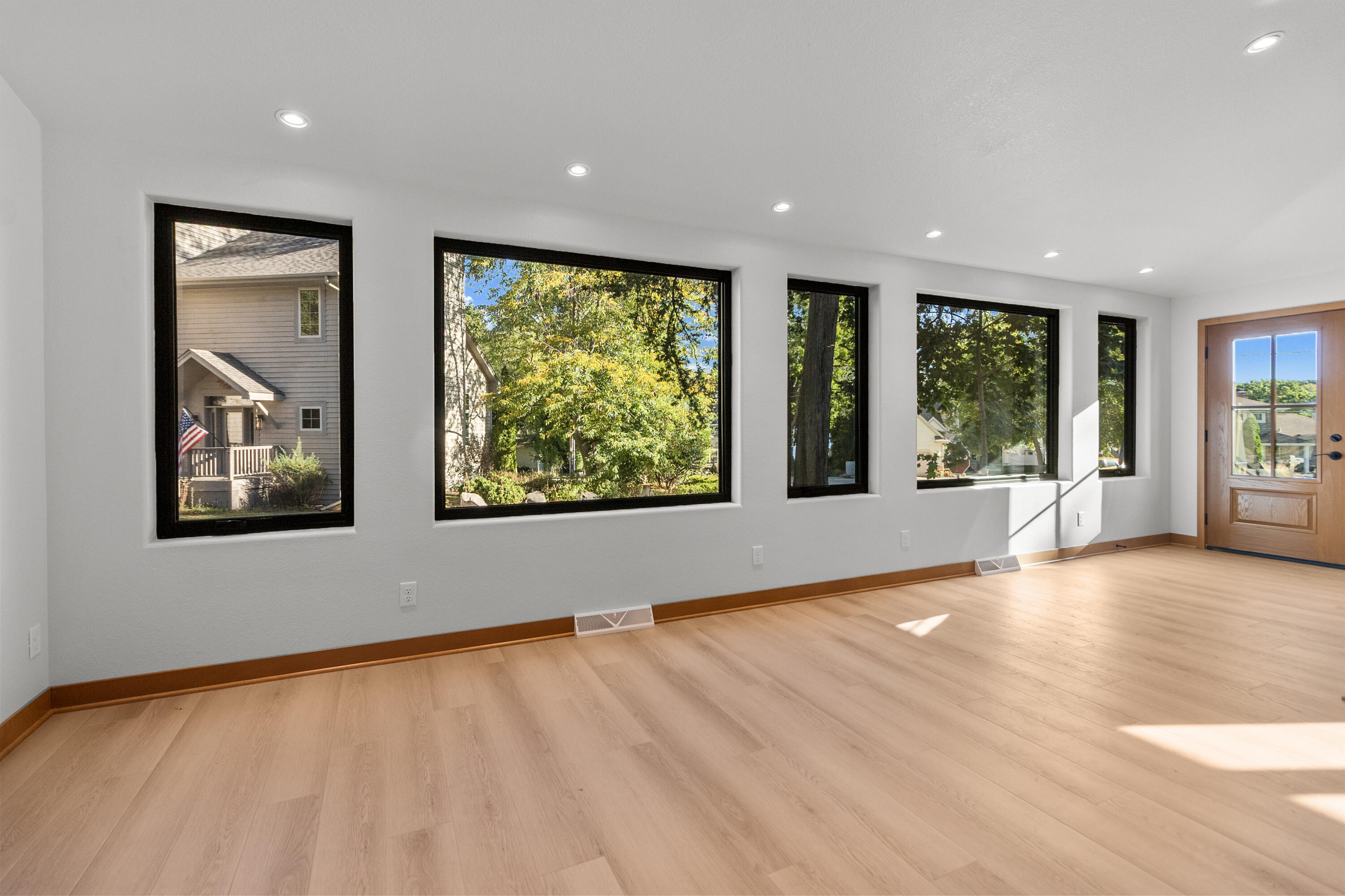 637 1st Street Delafield, WI 53018 - Photo 14 of 55 Wall of windows