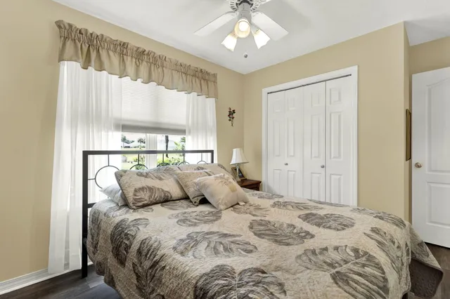 a bedroom with a large bed and a window