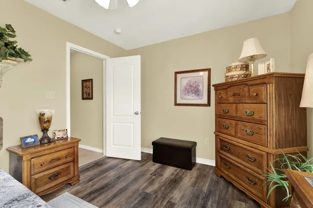 a room with a bed and a dresser