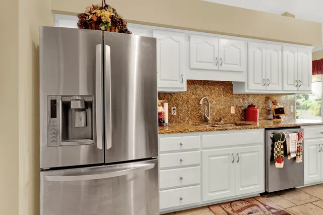 a bed room with a bed and a chandelier
