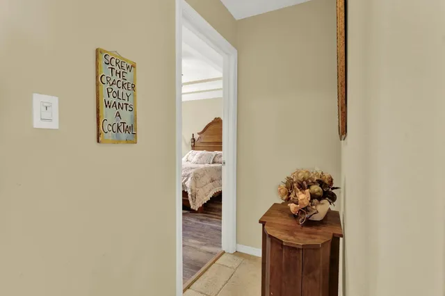 a bed room with a bed and a chandelier