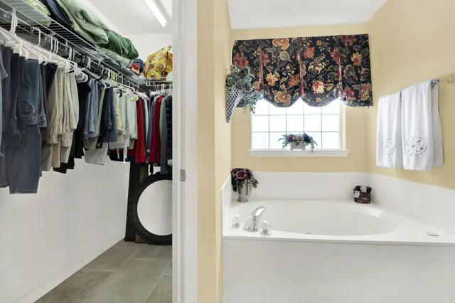 a view of a house with a yard and sitting area