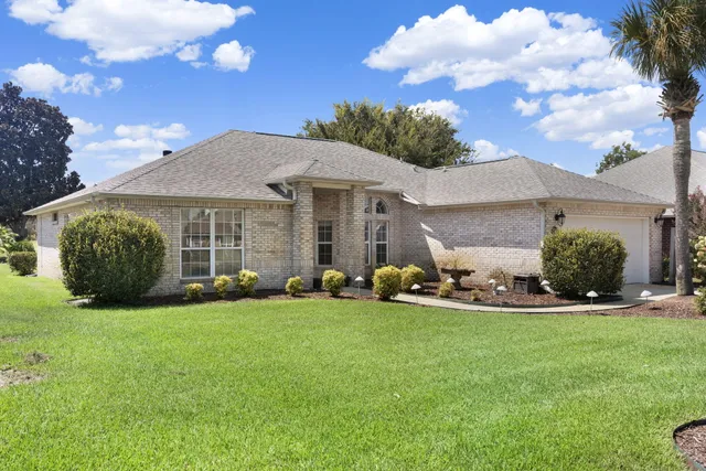 a view of a two chairs in the back yard