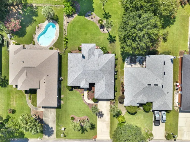 an aerial view of residential house with outdoor space and swimming pool