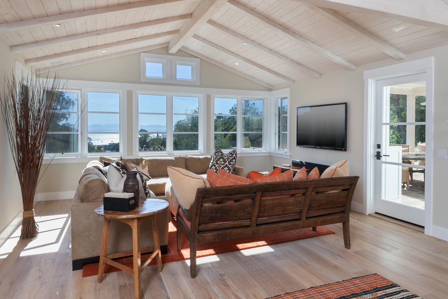 0 Alston Road Santa Barbara, CA 93108 - Photo 2 of 15 a living room with furniture a flat screen tv and floor to ceiling window