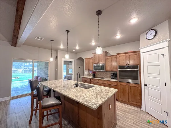 a bedroom with a large bed and a large window