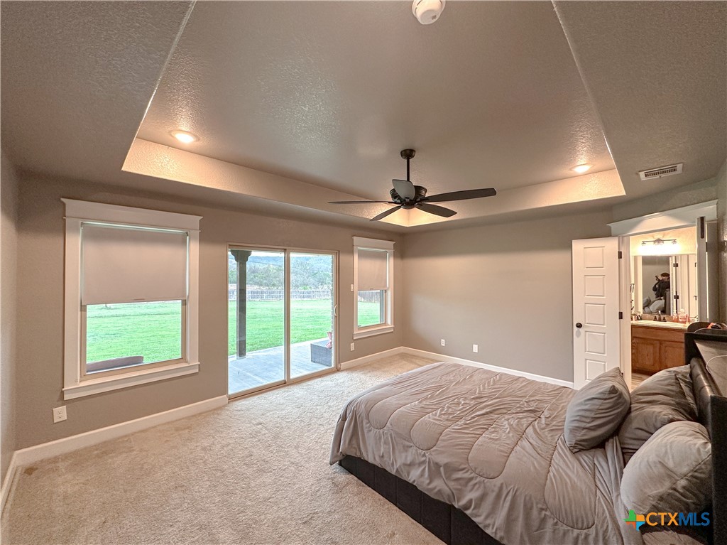 3533 Hooten Bend Kempner, TX 76539 - Photo 19 of 47 a bedroom with a large bed and a large window