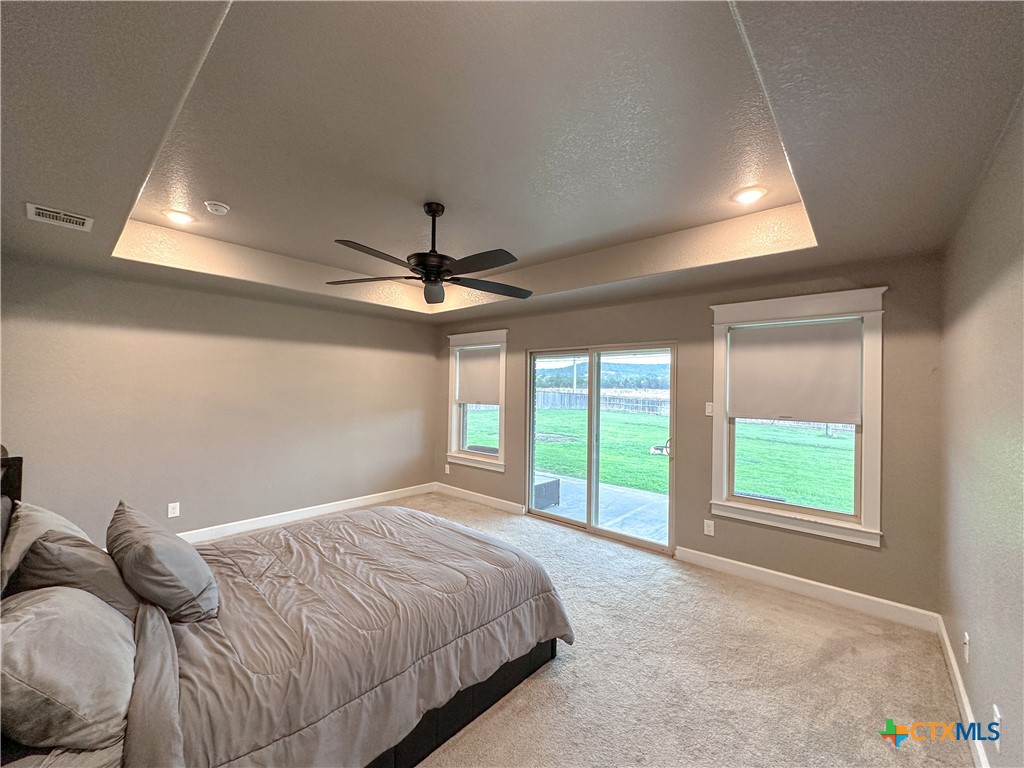 3533 Hooten Bend Kempner, TX 76539 - Photo 21 of 47 a bedroom with a large bed and a large window