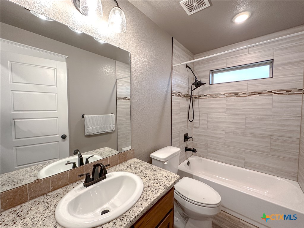 3533 Hooten Bend Kempner, TX 76539 - Photo 30 of 47 a bathroom with a sink toilet and shower
