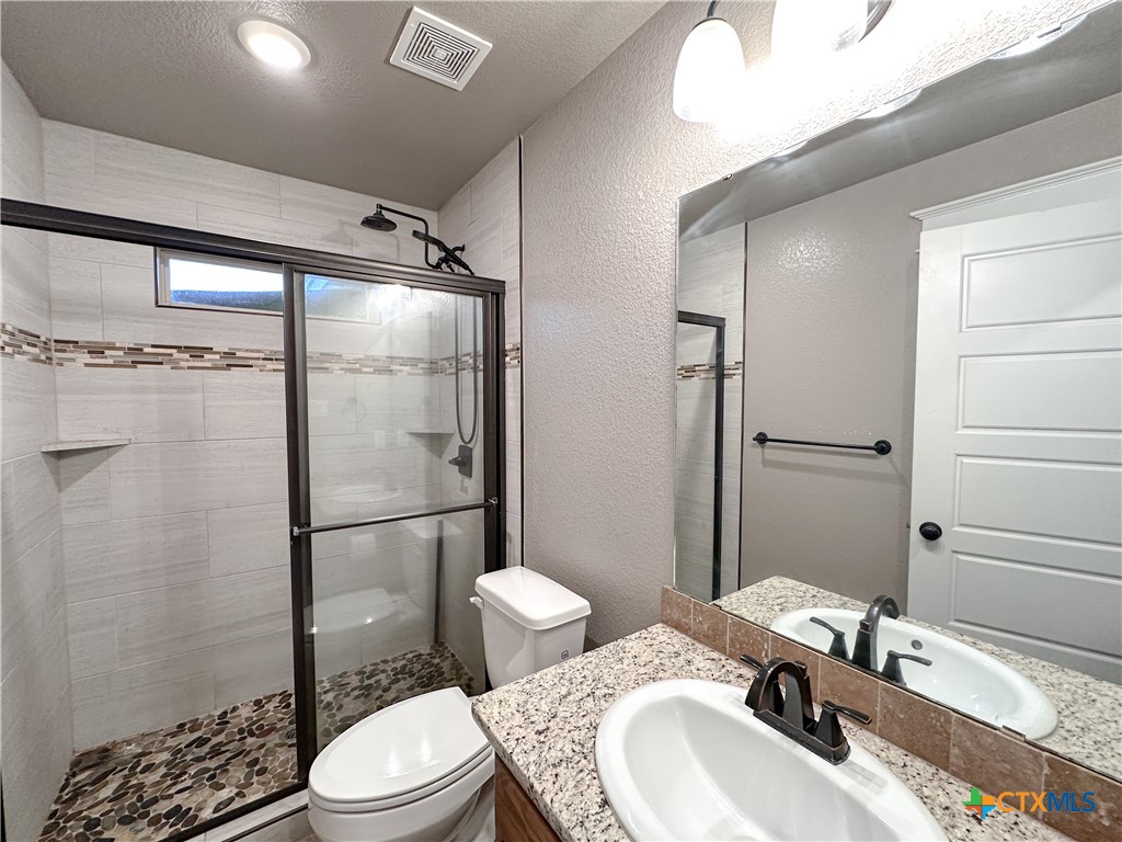 3533 Hooten Bend Kempner, TX 76539 - Photo 33 of 47 a bathroom with a sink toilet and shower
