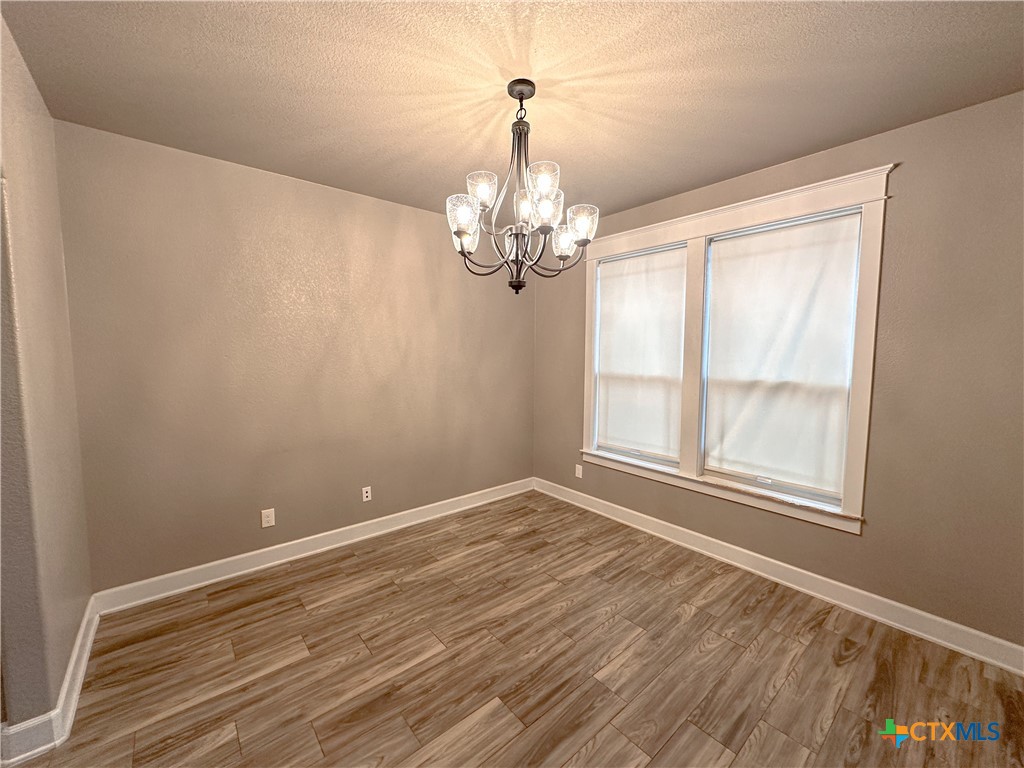 3533 Hooten Bend Kempner, TX 76539 - Photo 9 of 47 a view of empty room with wooden floor and fan