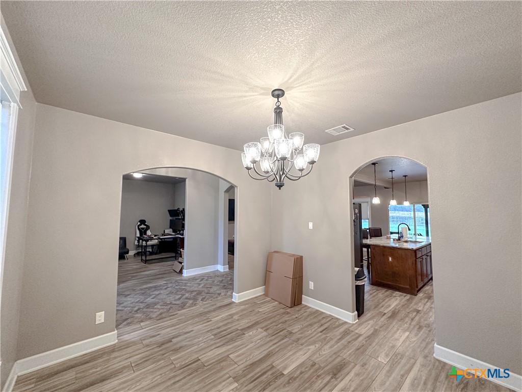 3533 Hooten Bend Kempner, TX 76539 - Photo 10 of 47 a view of a livingroom with a furniture wooden floor and kitchen