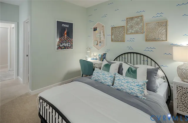 a bed sitting in a bedroom next to a window