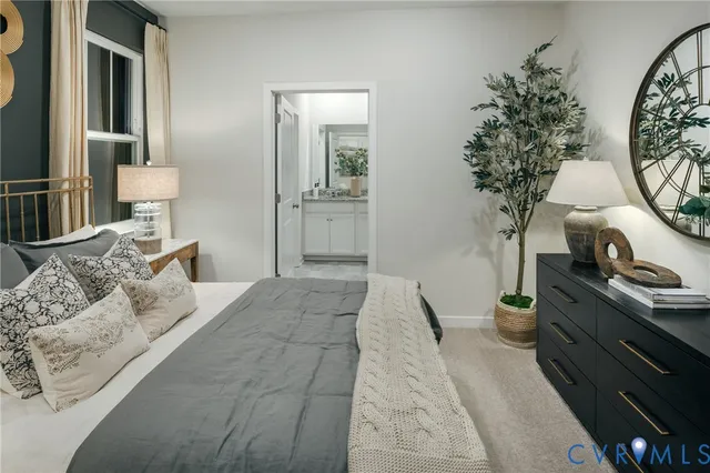 a bedroom with furniture and a potted plant