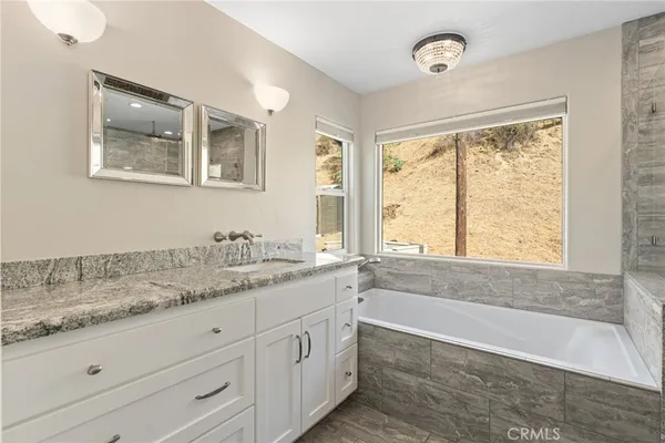 a kitchen with stainless steel appliances kitchen island a refrigerator sink and stove