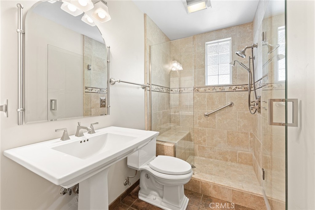 30300 Live Oak Canyon Road Redlands, CA 92373 - Photo 50 of 67 a bathroom with a sink toilet a mirror and shower