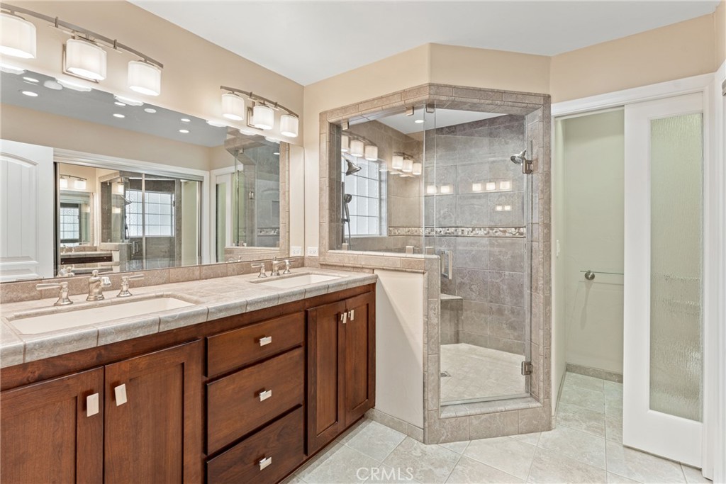30300 Live Oak Canyon Road Redlands, CA 92373 - Photo 54 of 67 a bathroom with a granite countertop sink mirror and shower