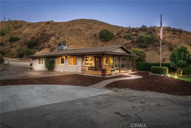 an aerial view of a house with a garden