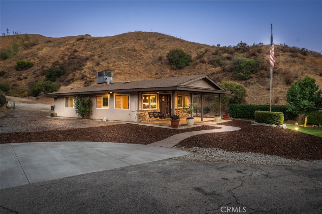 30300 Live Oak Canyon Road Redlands, CA 92373 - Photo 8 of 67 a front view of a house with a yard