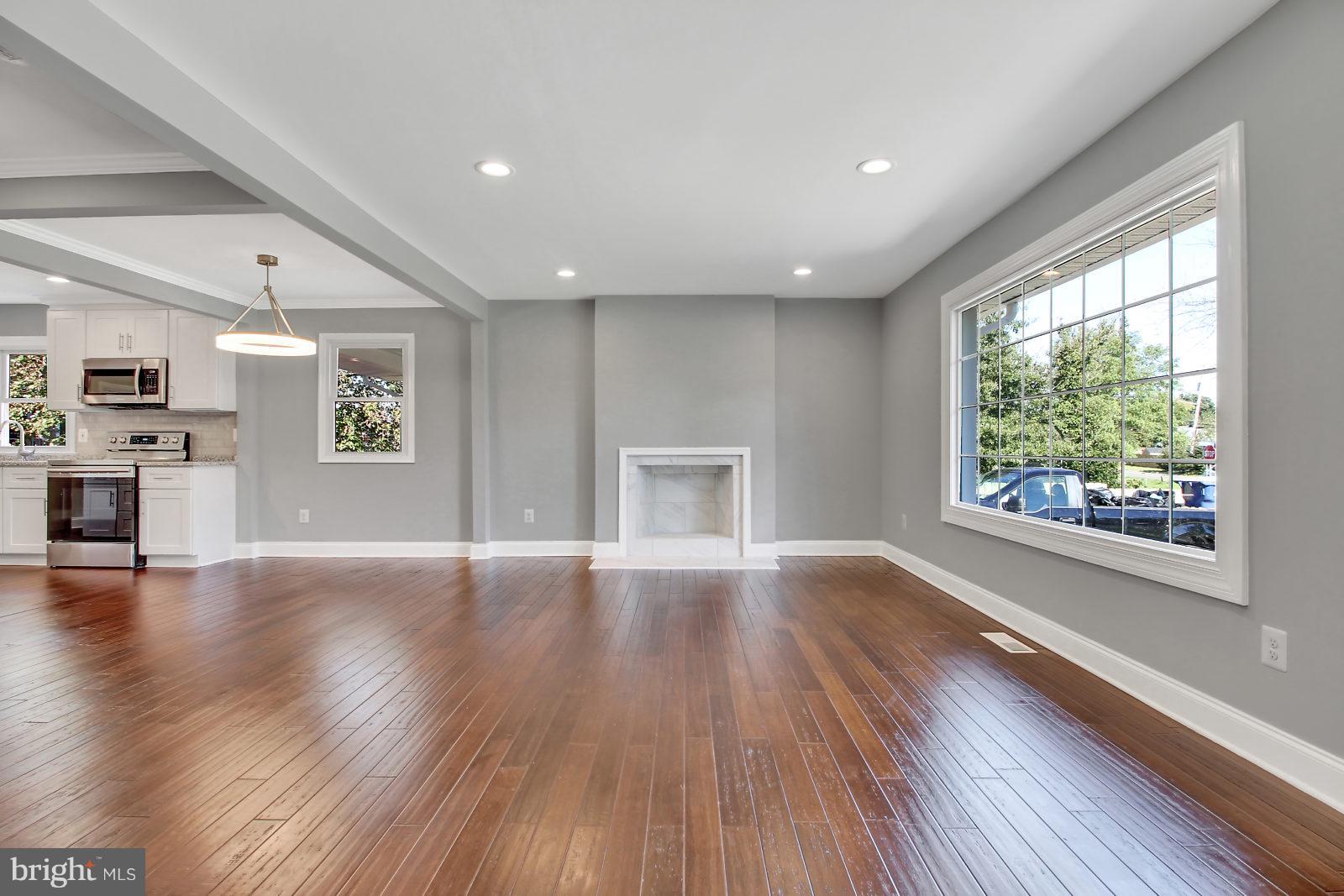 6704 Quander Road Alexandria, VA 22307 - Photo 2 of 27 Family Room with fireplace and wood floors