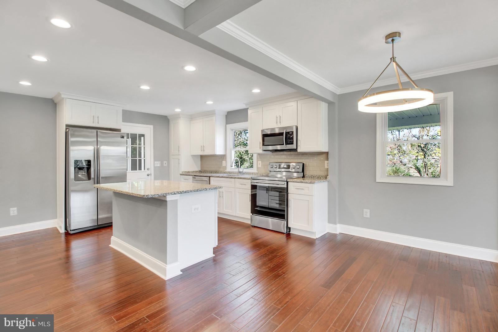6704 Quander Road Alexandria, VA 22307 - Photo 5 of 27 Dining room with open kitchen