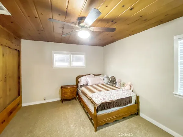 a bathroom with a shower a toilet and a shower