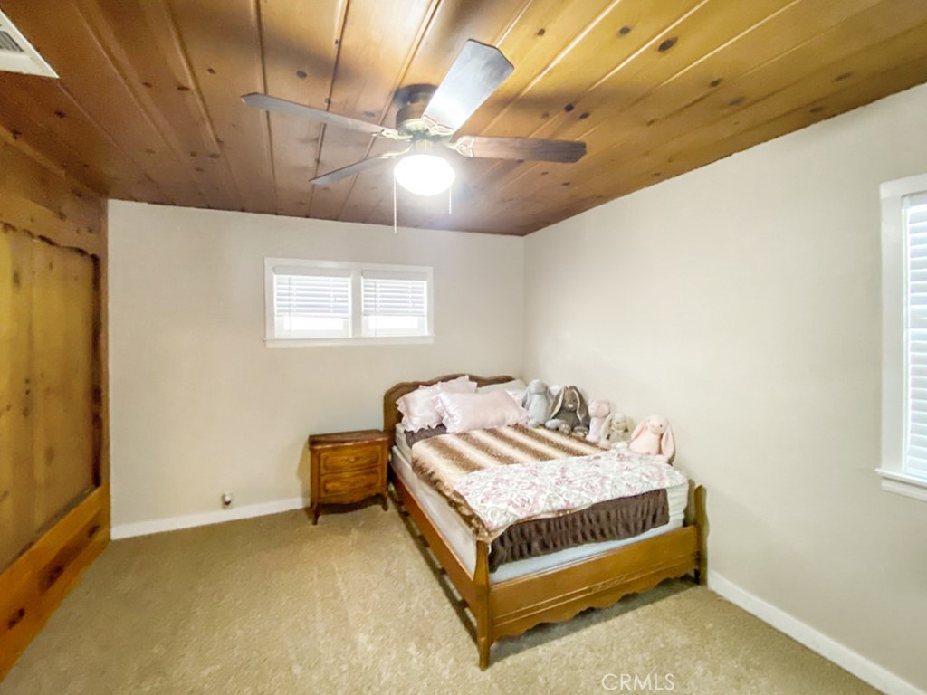 907 Ball Mountain Little Shasta Road Montague, CA 96064 - Photo 16 of 34 a bedroom with a bed and a window