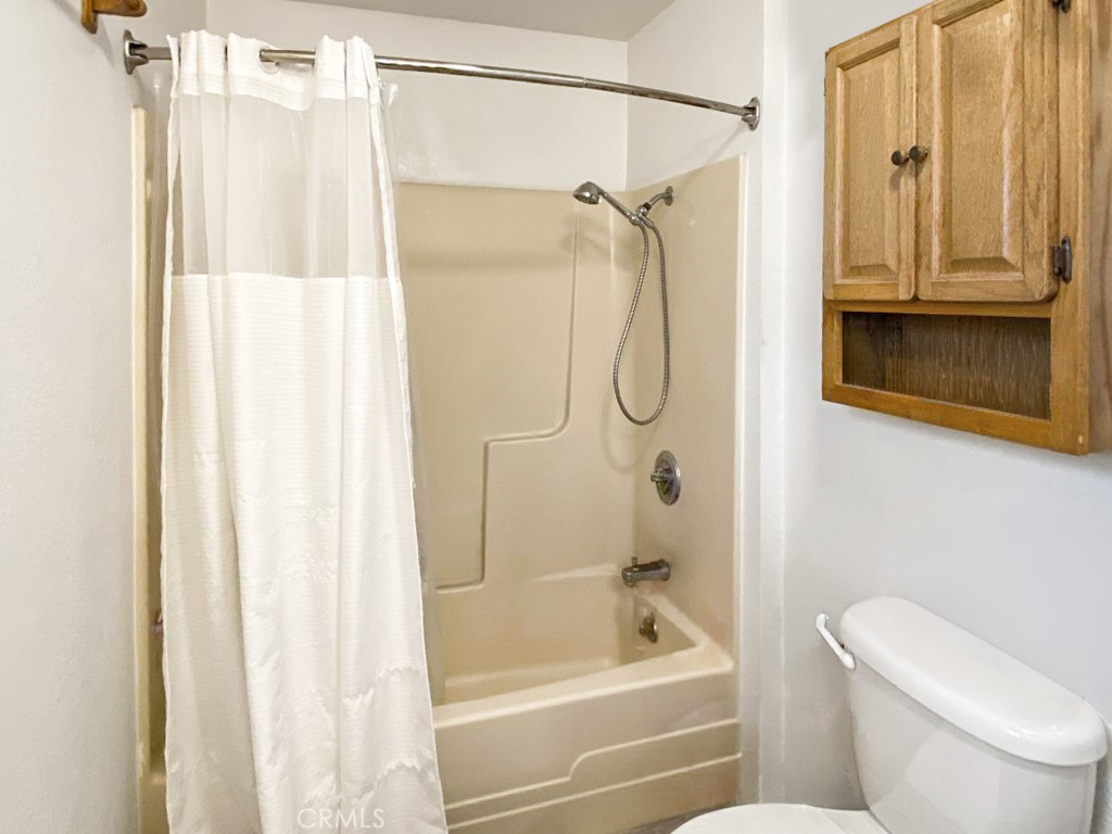 907 Ball Mountain Little Shasta Road Montague, CA 96064 - Photo 18 of 34 a bathroom with a shower a toilet and a shower