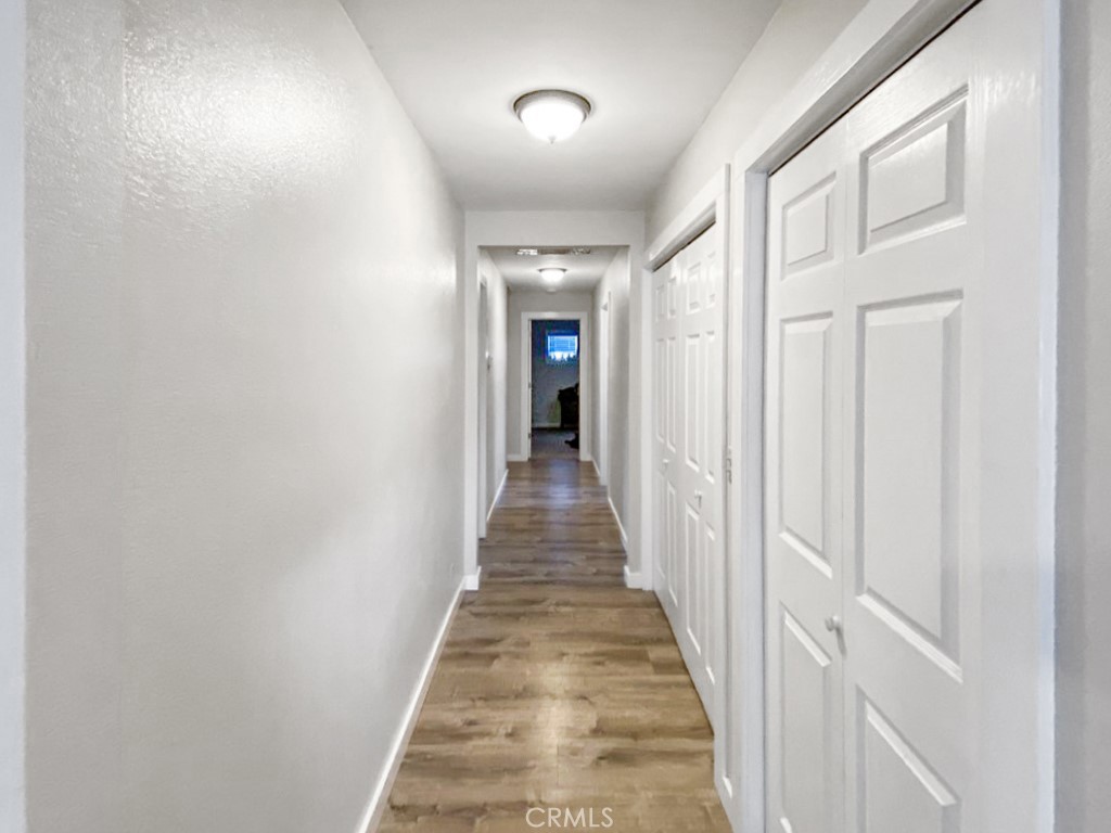 907 Ball Mountain Little Shasta Road Montague, CA 96064 - Photo 19 of 34 a view of a hallway with wooden floor and closet