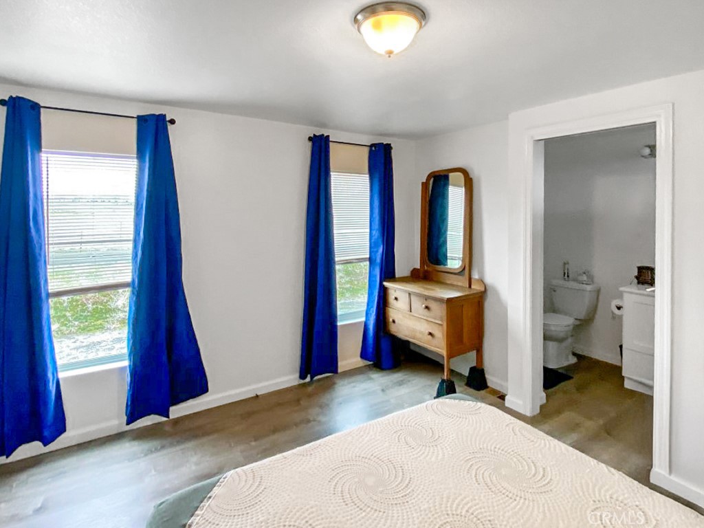 907 Ball Mountain Little Shasta Road Montague, CA 96064 - Photo 26 of 34 a bedroom with a bed and wooden floor