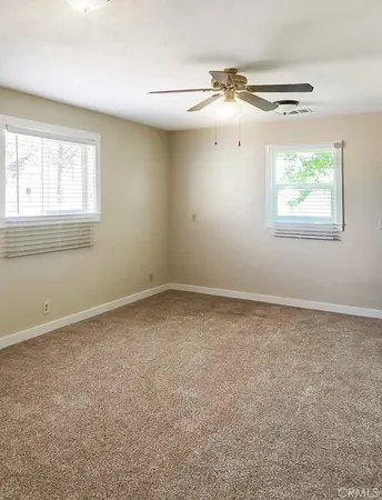 a living room with a couch and a walk in closet