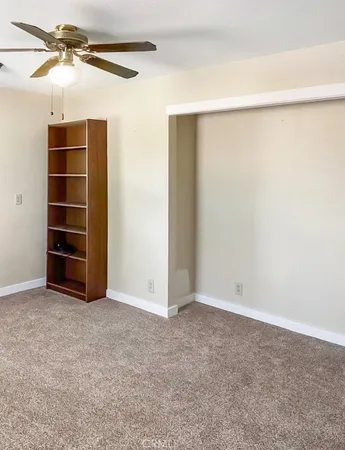 a kitchen with a sink a refrigerator and window