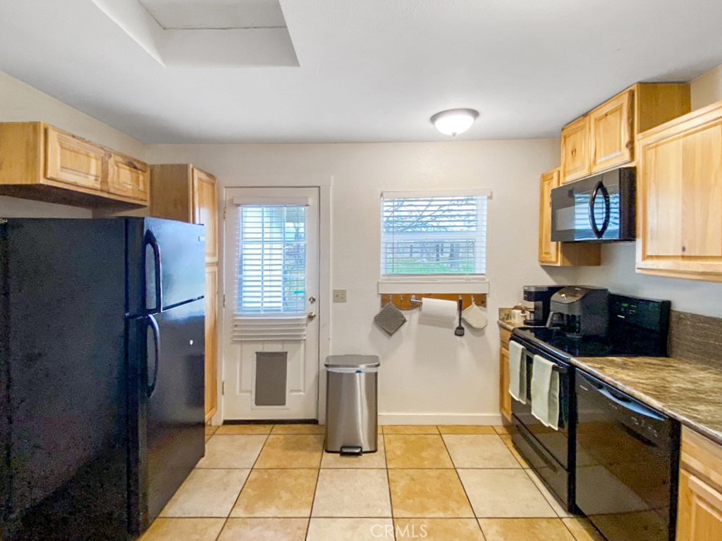 907 Ball Mountain Little Shasta Road Montague, CA 96064 - Photo 31 of 34 a kitchen with a sink a refrigerator and window