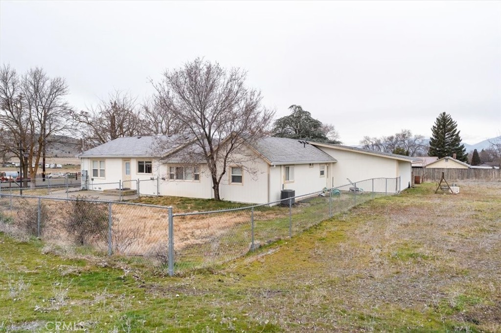 907 Ball Mountain Little Shasta Road Montague, CA 96064 - Photo 10 of 34 a white house that has a tree in front of it