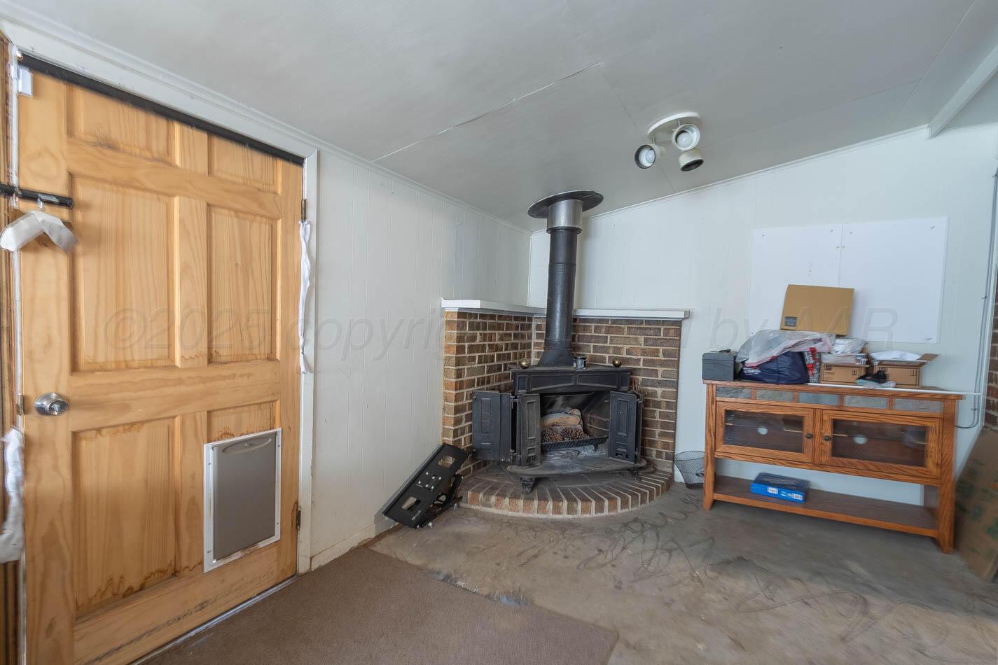 5126 Royce Drive Amarillo, TX 79110 - Photo 13 of 16 DEN WITH WOOD STOVE