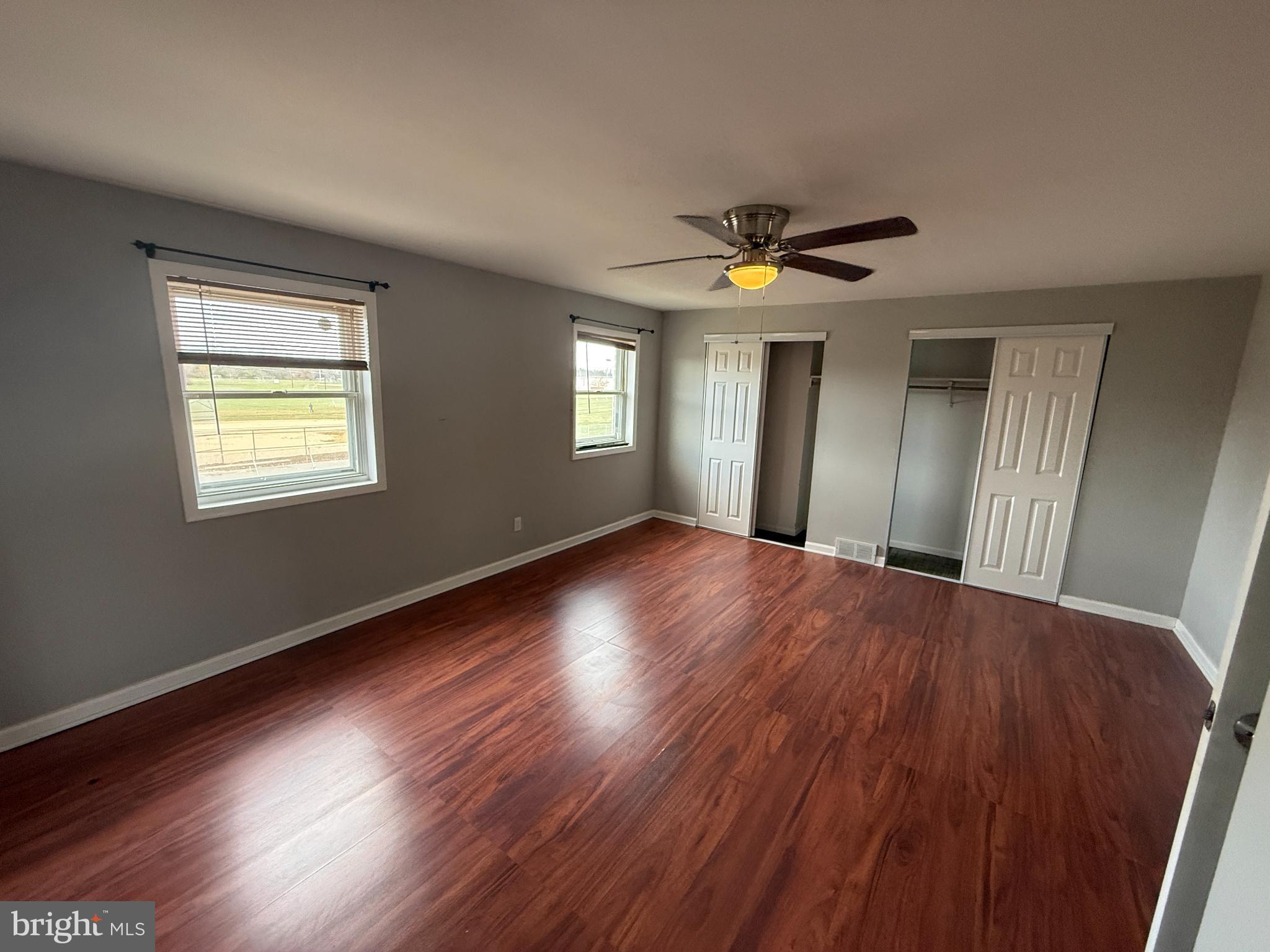 12789 Dunks Road Philadelphia, PA 19154 - Photo 12 of 23 a view of an empty room with wooden floor and a window
