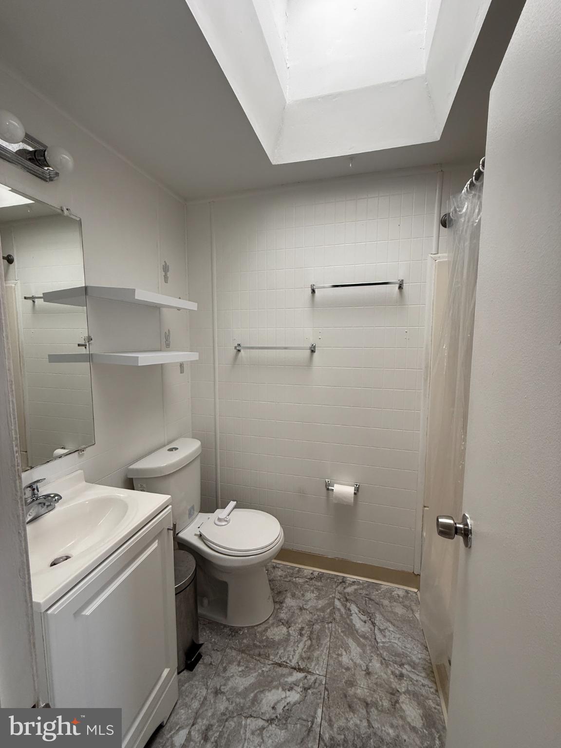 12789 Dunks Road Philadelphia, PA 19154 - Photo 15 of 23 a bathroom with a granite countertop toilet and a sink