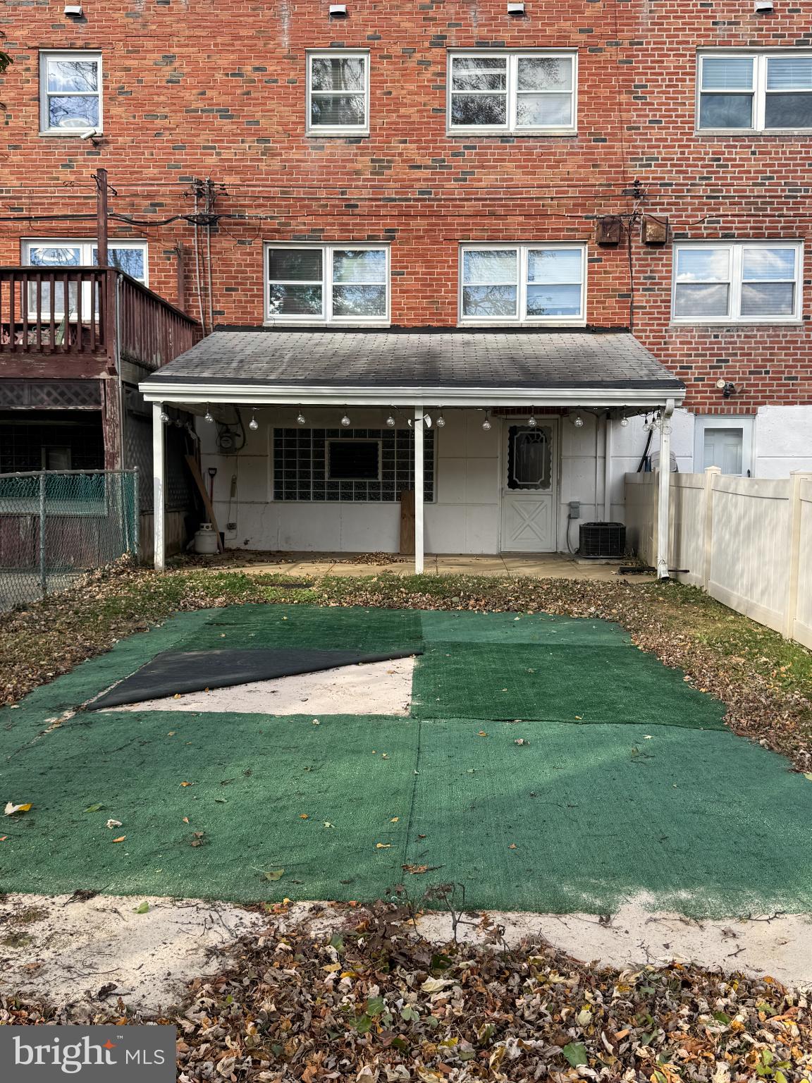 12789 Dunks Road Philadelphia, PA 19154 - Photo 23 of 23 a front view of a brick house with a yard
