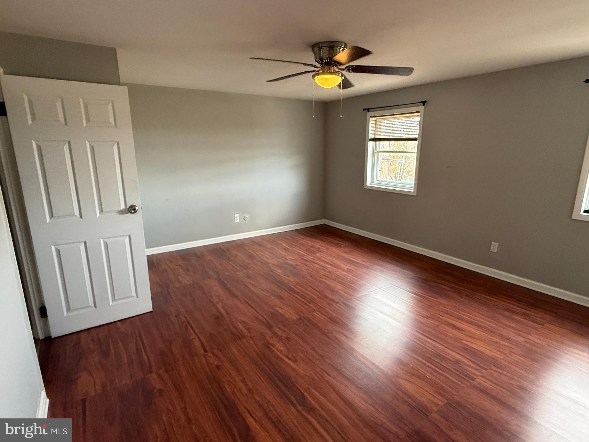 12789 Dunks Road Philadelphia, PA 19154 - Photo 10 of 23 an empty room with wooden floor and windows