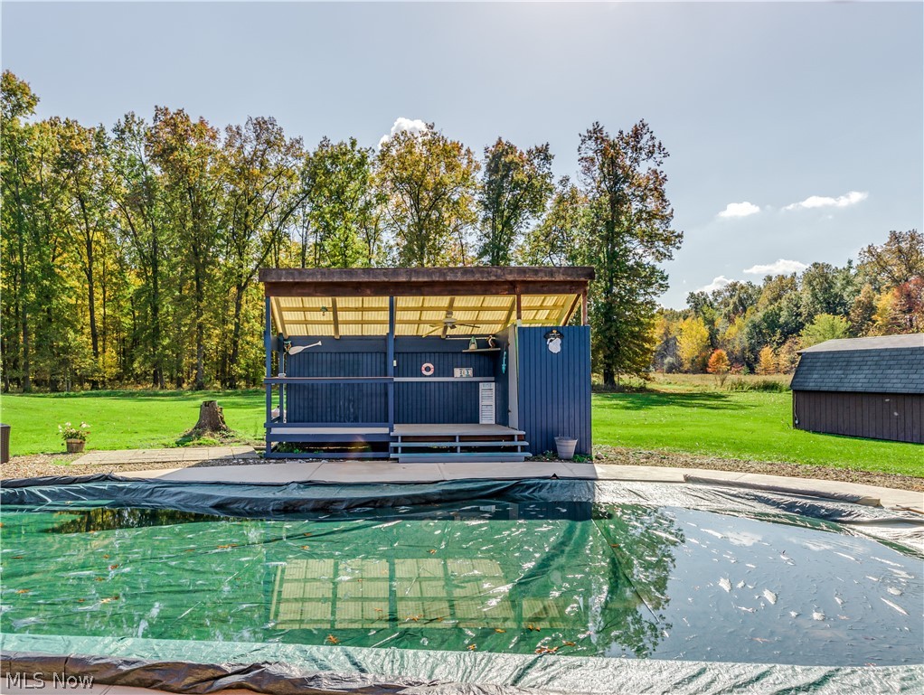 11520 Lair Road Northeast Alliance, OH 44601 - Photo 6 of 33 Also included is an in-ground pool with a sitting area/covered deck.