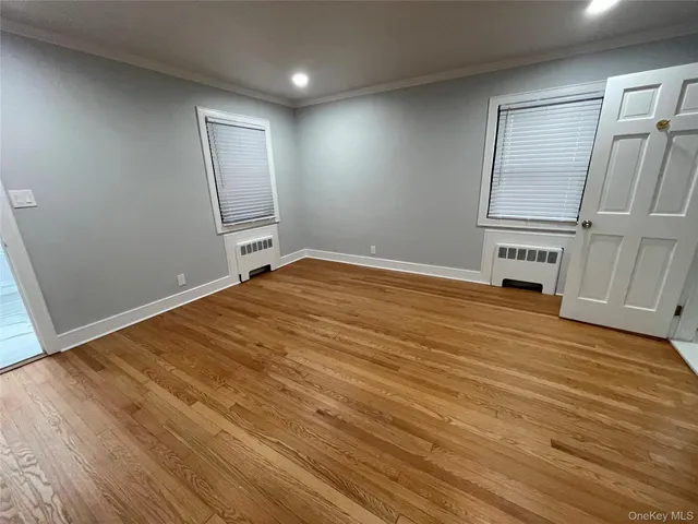 a view of an empty room with a fireplace