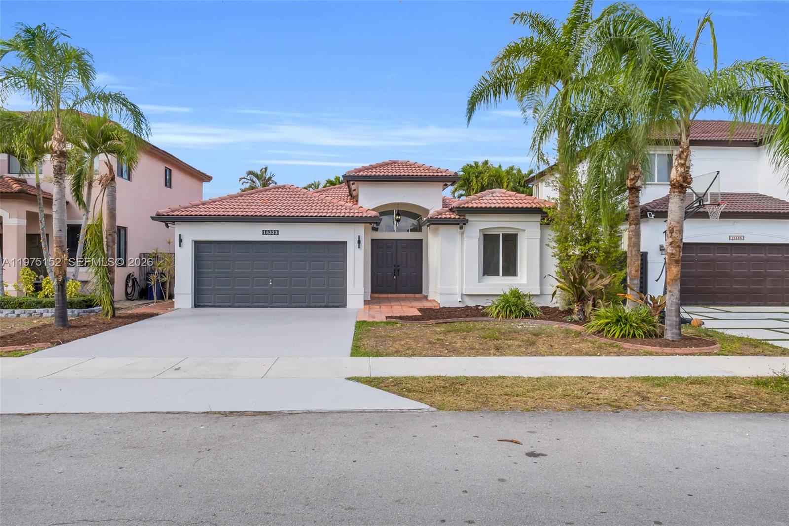 front view of a house with a yard