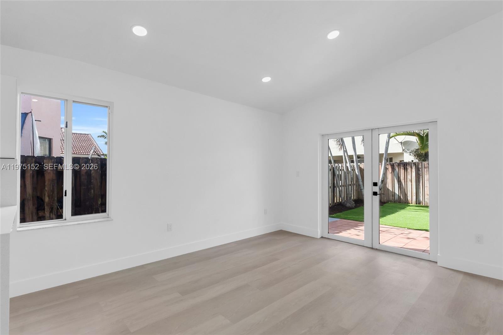 16333 Southwest 68th Terrace Miami, FL 33193 - Photo 18 of 32 a view of an empty room with floor to ceiling window