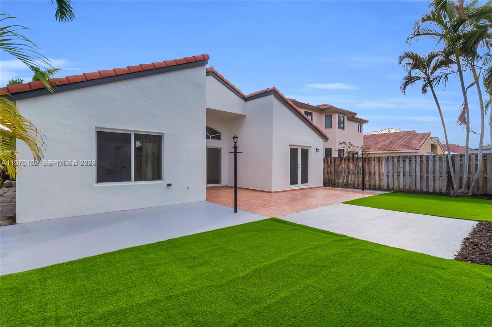 16333 Southwest 68th Terrace Miami, FL 33193 - Photo 2 of 32 a view of a house with a yard and tree s