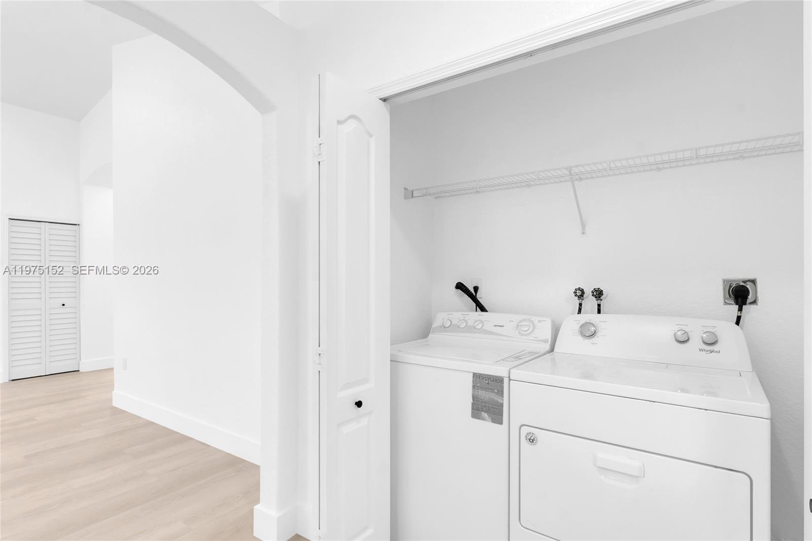 16333 Southwest 68th Terrace Miami, FL 33193 - Photo 23 of 32 a utility room with dryer and washer
