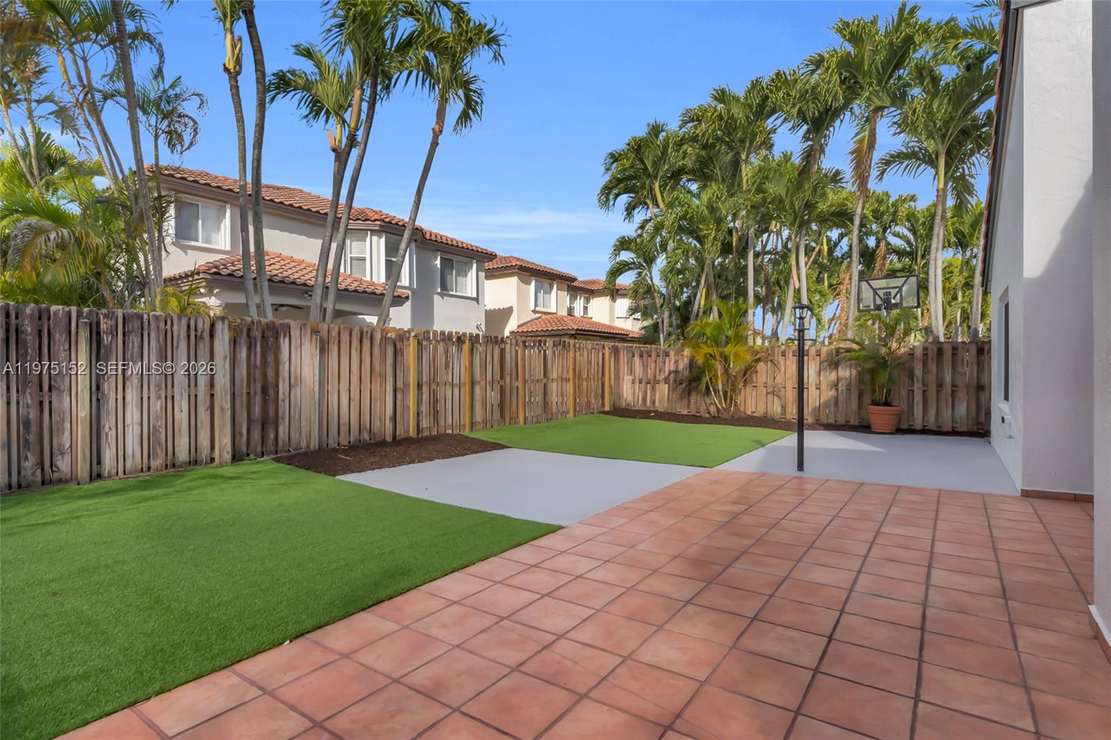 16333 Southwest 68th Terrace Miami, FL 33193 - Photo 24 of 32 a view of backyard with palm trees