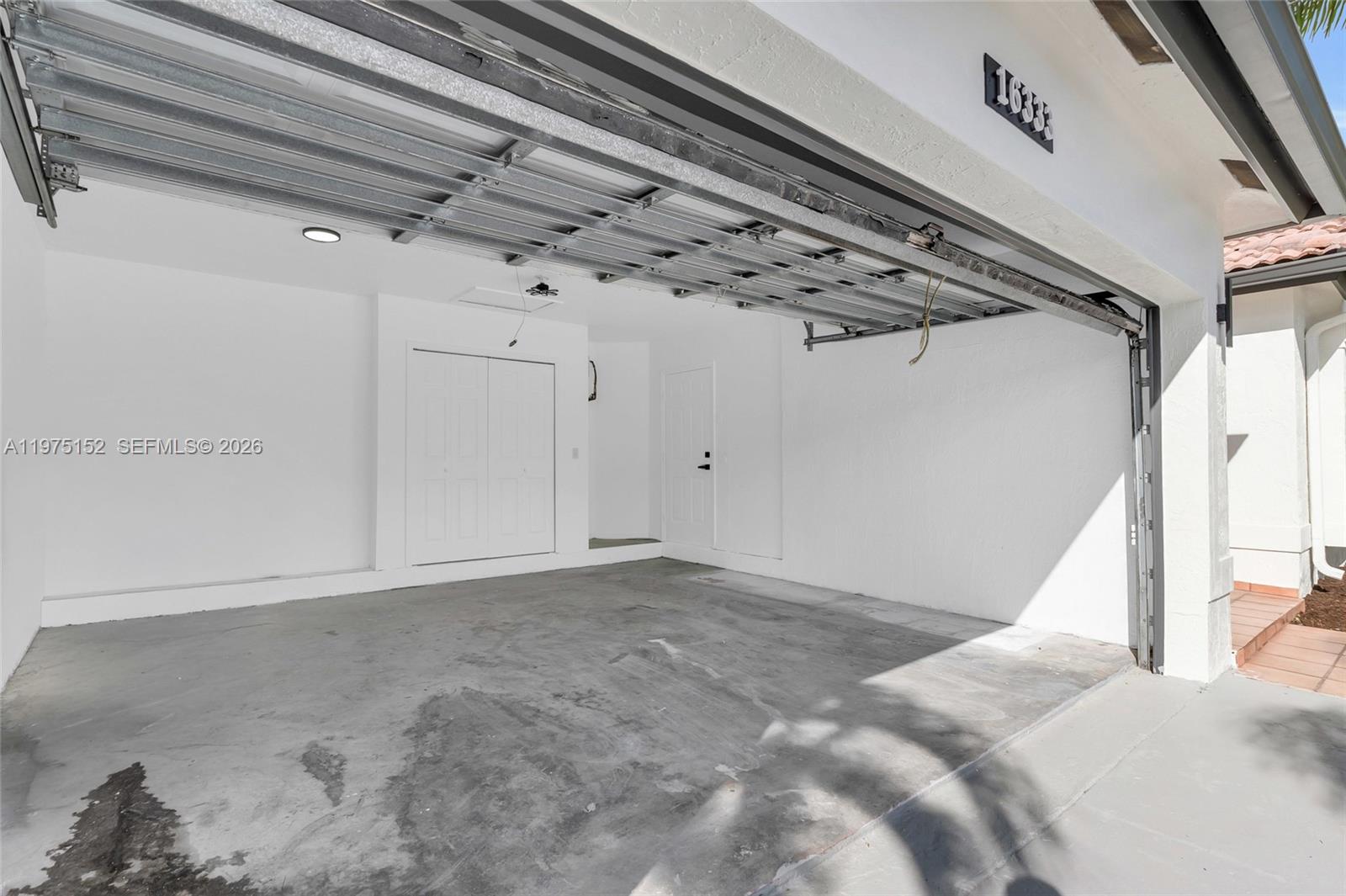 16333 Southwest 68th Terrace Miami, FL 33193 - Photo 27 of 32 a view of a room with an empty space